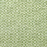 Fabric sample of a green and neutral printed linen fabric with a geometric pattern