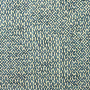 Fabric sample of a blue and neutral printed linen fabric with a geometric pattern