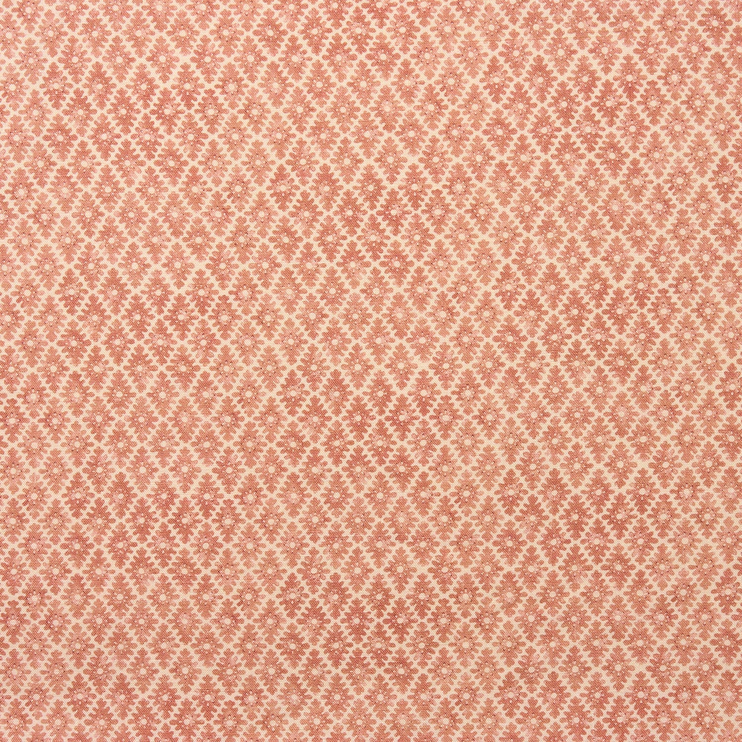 Fabric sample of a orange and neutral printed linen fabric with a geometric pattern