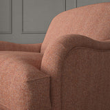 Red chair upholstered in a herringbone pure wool woven fabric.
