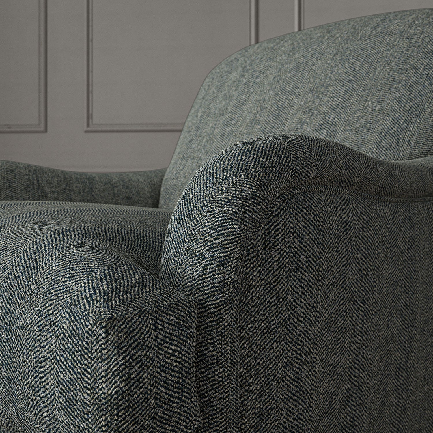 Blue chair upholstered in a herringbone pure wool woven fabric.