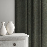 Blue curtain made from a plain pure wool woven fabric.
