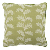 Green embroidered cushion with white leaf pattern.