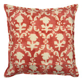 Decorative pillow with red and white floral pattern on a white background