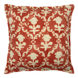 Decorative pillow with red and ivory floral pattern.