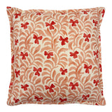Decorative cushion with a red and pink floral pattern.