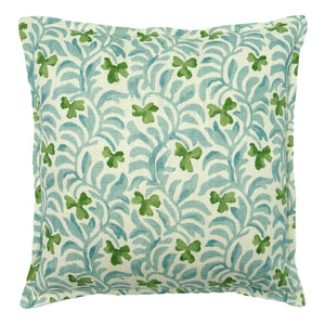 Decorative cushion with a pale blue and green floral pattern.