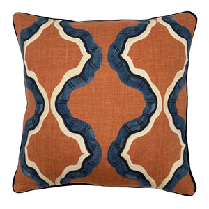Blue and terracotta linen cushion with a mirrored ribbon pattern.