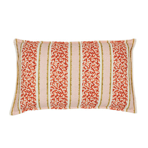 A red, pink and yellow linen cushion with a stylised coral pattern.