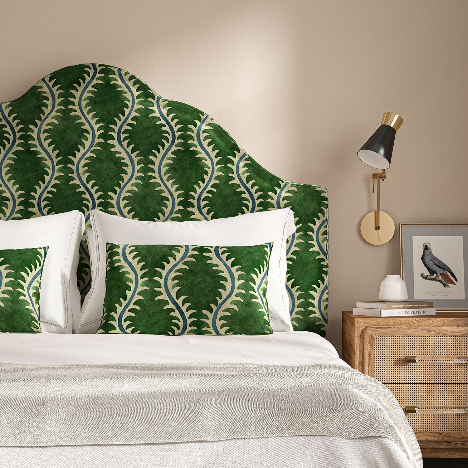 Headboard upholstered in a printed velvet fabric in green and blue
featuring a stylized fern pattern.
