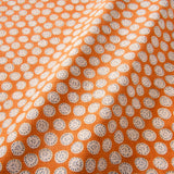 A linen printed with a subtle all-over repeat in orange, cream and black