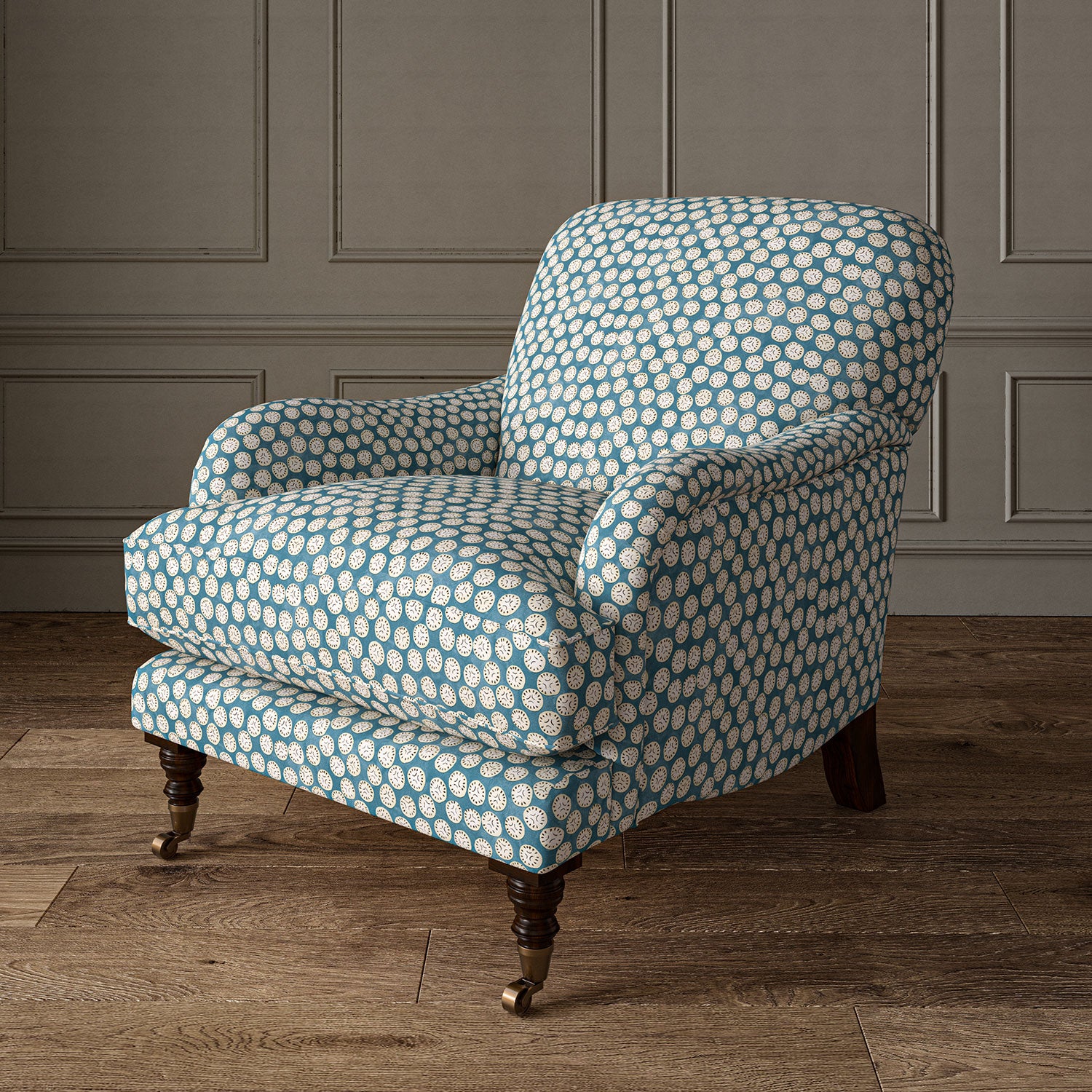 Armchair covered in a linen printed with a subtle all-over repeat in blue, cream and black