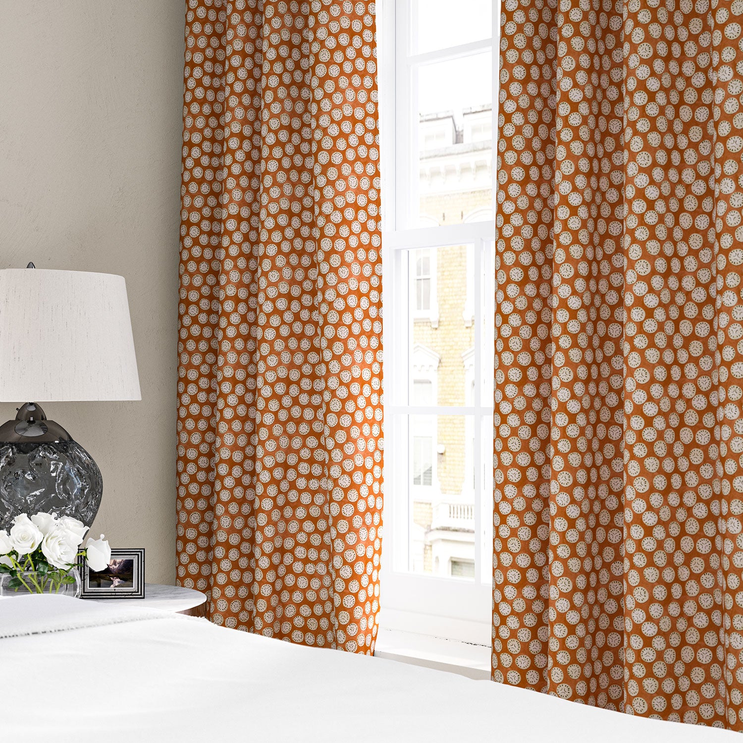 Linen curtain with a subtle all-over repeat in orange, cream and black