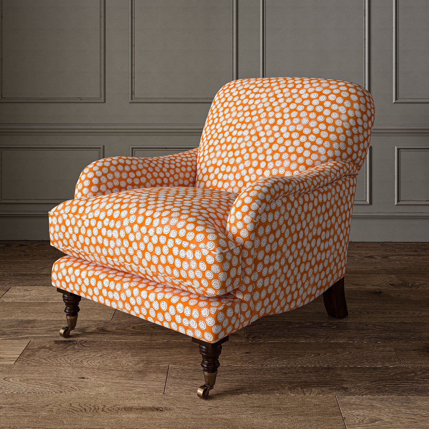 Armchair covered in a linen printed with a subtle all-over repeat in orange, cream and black