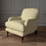 Armchair covered in a linen printed with a subtle all-over repeat in yellow, cream and black