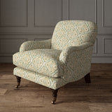 Armchair covered in a linen print with a handcrafted feel in pale green