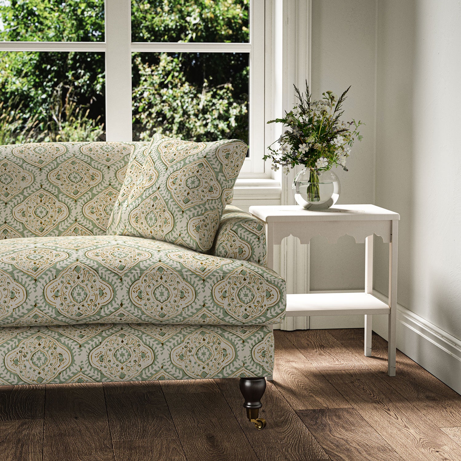 Sofa covered in a linen print with a handcrafted feel in pale green
