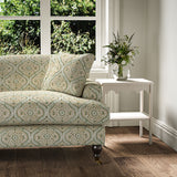Sofa covered in a linen print with a handcrafted feel in pale green