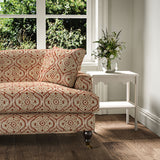 Sofa covered in a linen print with a handcrafted feel in red