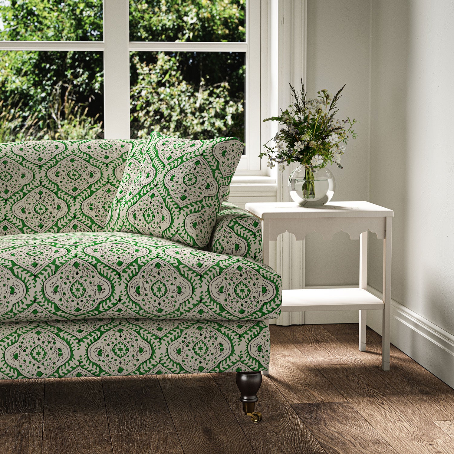 Sofa covered in a linen print with a handcrafted feel in green