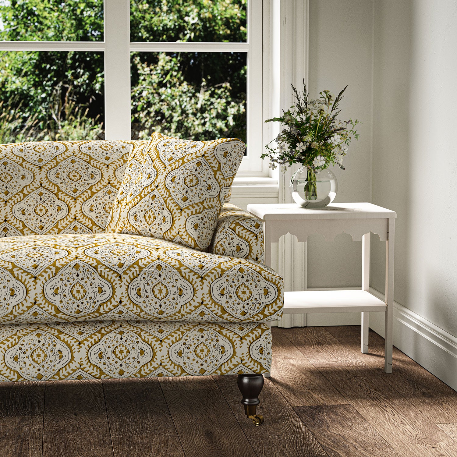 Sofa covered in a linen print with a handcrafted feel in ochre