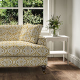 Sofa covered in a linen print with a handcrafted feel in ochre