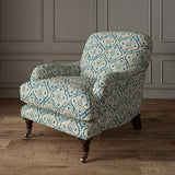 Armchair covered in a linen print with a handcrafted feel in blue