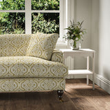 Sofa covered in a linen print with a handcrafted feel in bronze