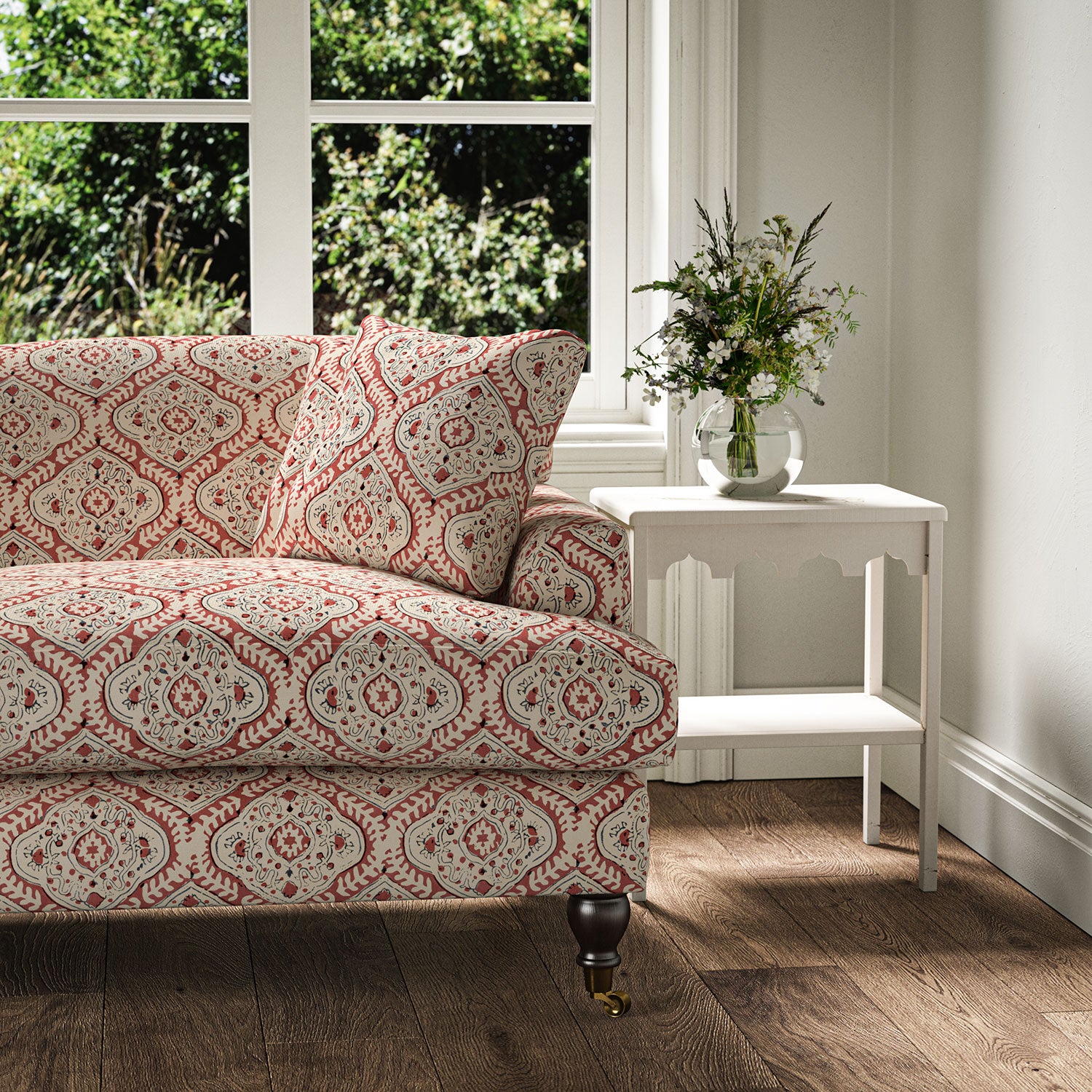 Sofa covered in a linen print with a handcrafted feel in red