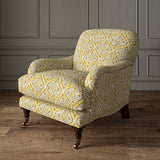Armchair covered in a linen print with a handcrafted feel in yellow