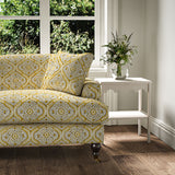 Sofa covered in a linen print with a handcrafted feel in yellow