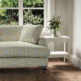 Sofa covered in a linen print with a handcrafted feel in blue