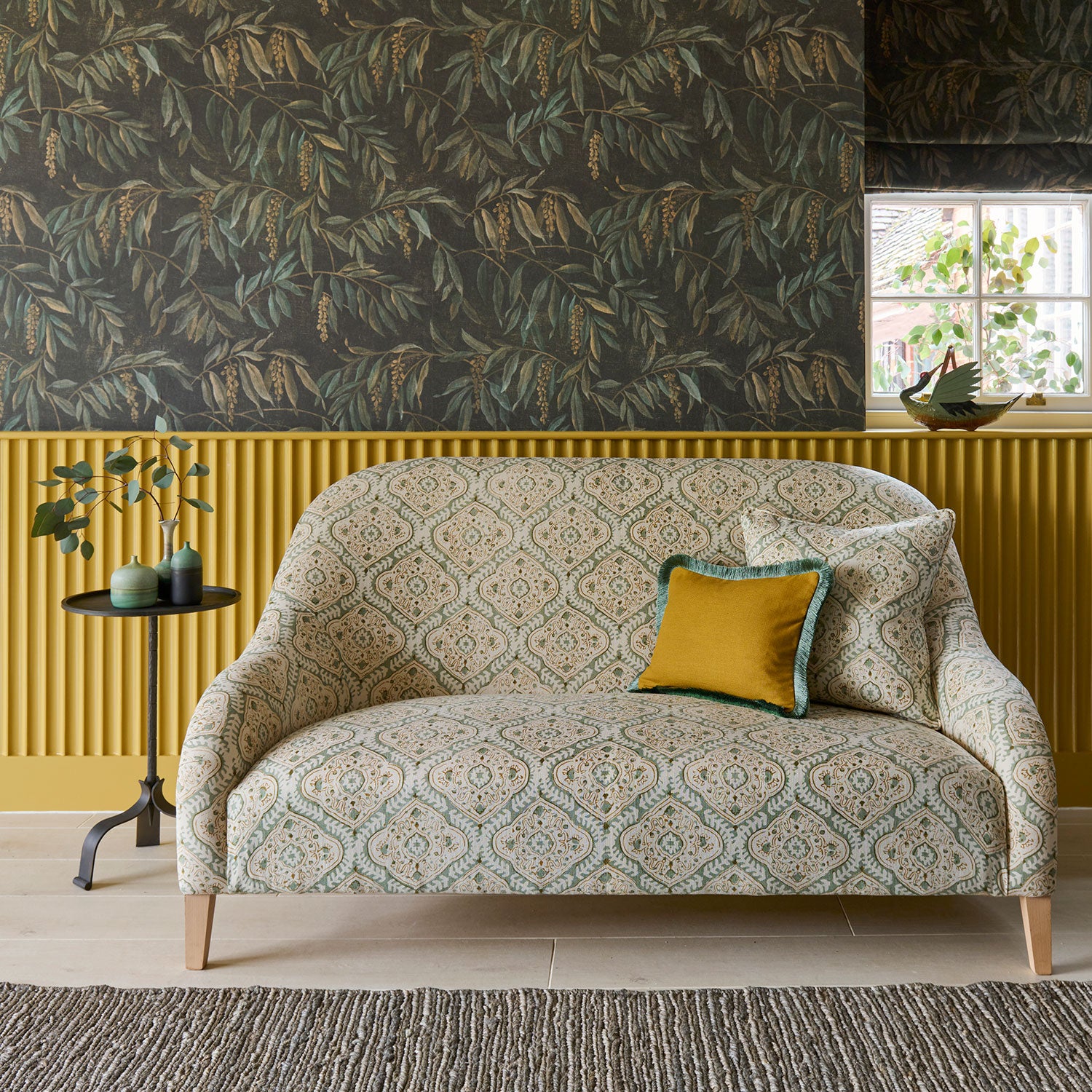 Sofa covered in a linen print with a handcrafted feel in pale green