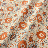 A stylised floral printed on linen fabric in red, blue and cream