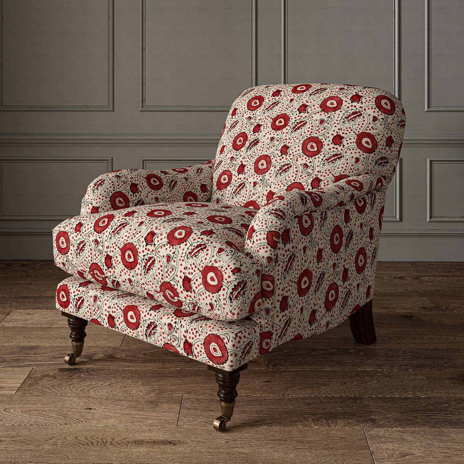 Armchair covered with a stylised floral printed on linen fabric in red, black and cream