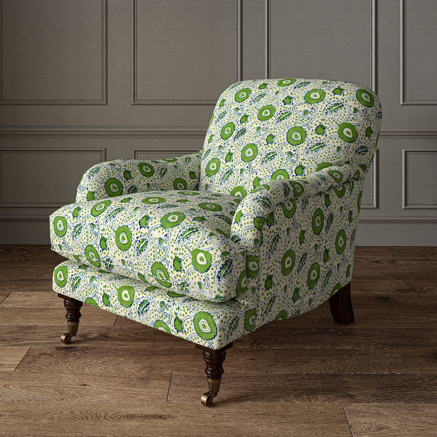 Armchair covered with a stylised floral printed on linen fabric in green, blue and cream