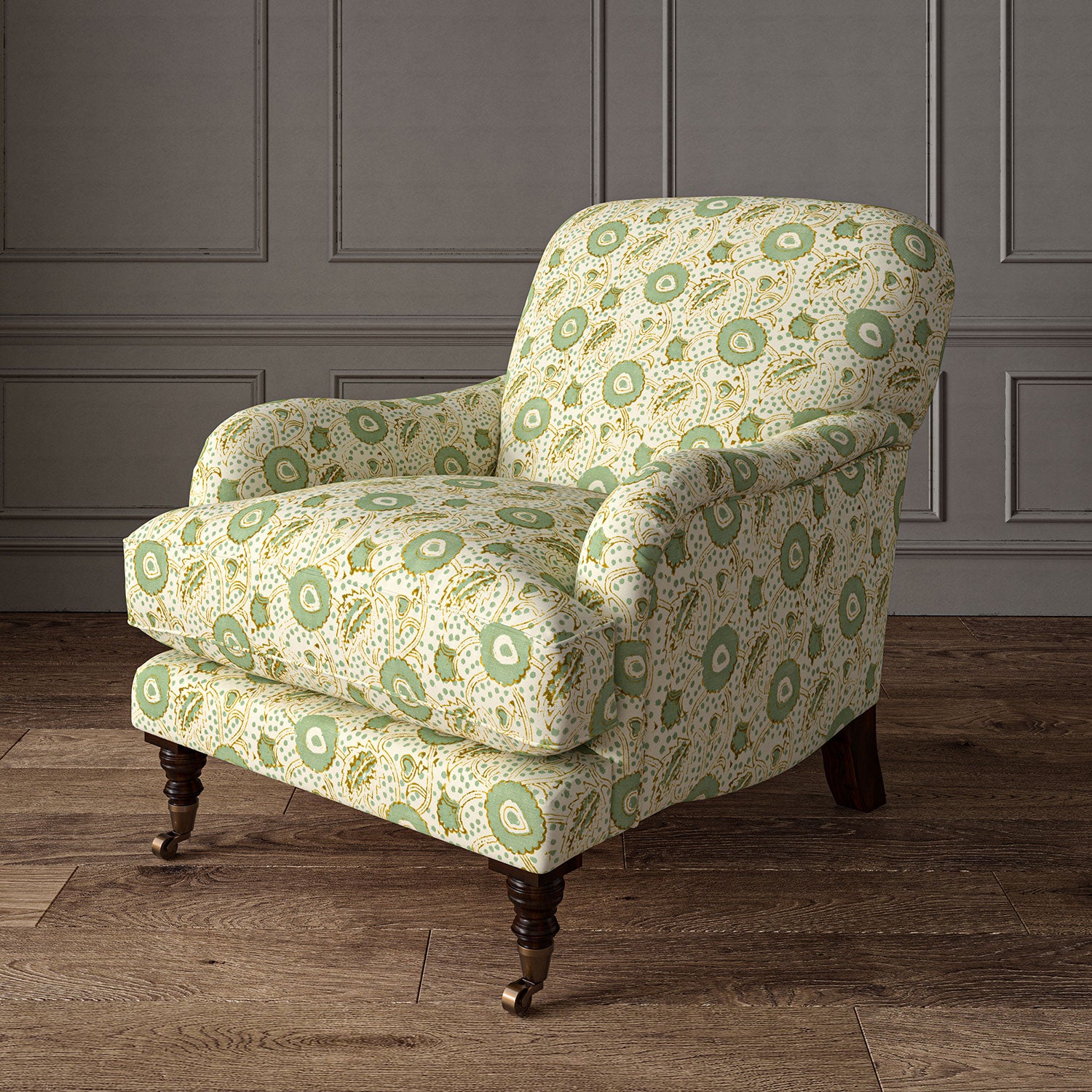 Armchair covered with a stylised floral printed on linen fabric in green, orange and cream