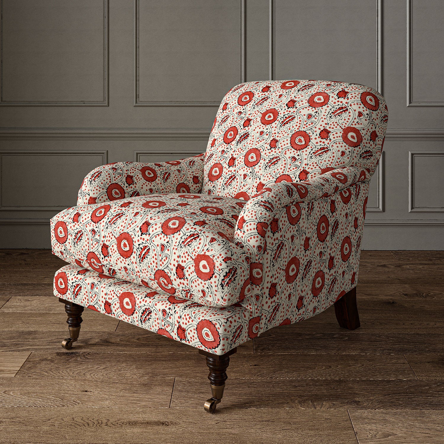 Armchair covered with a stylised floral printed on linen fabric in red, black and cream