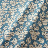 A jolly printed linen fabric in blue, black and cream