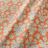 A jolly printed linen fabric in orange, blue and cream