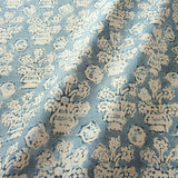 A jolly printed linen fabric in blue, black and cream