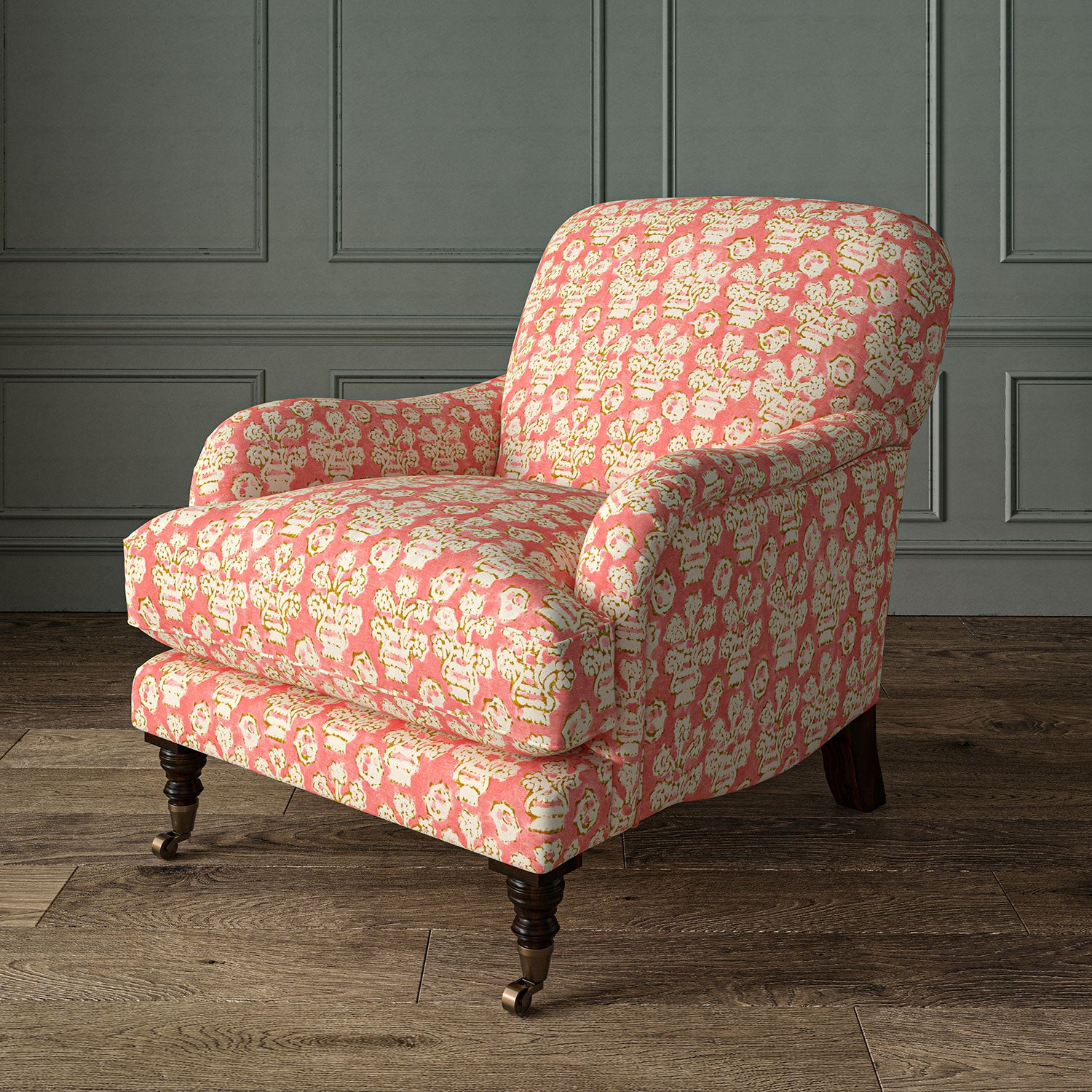 Armchair covered in a jolly printed linen fabric in pink, orange and cream