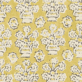 A jolly printed linen fabric in yellow, black and cream