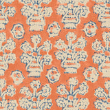 A jolly printed linen fabric in orange, blue and cream