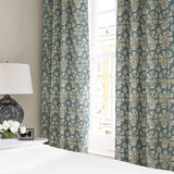 Linen curtain with a jolly and characterful pattern in blue, black and cream