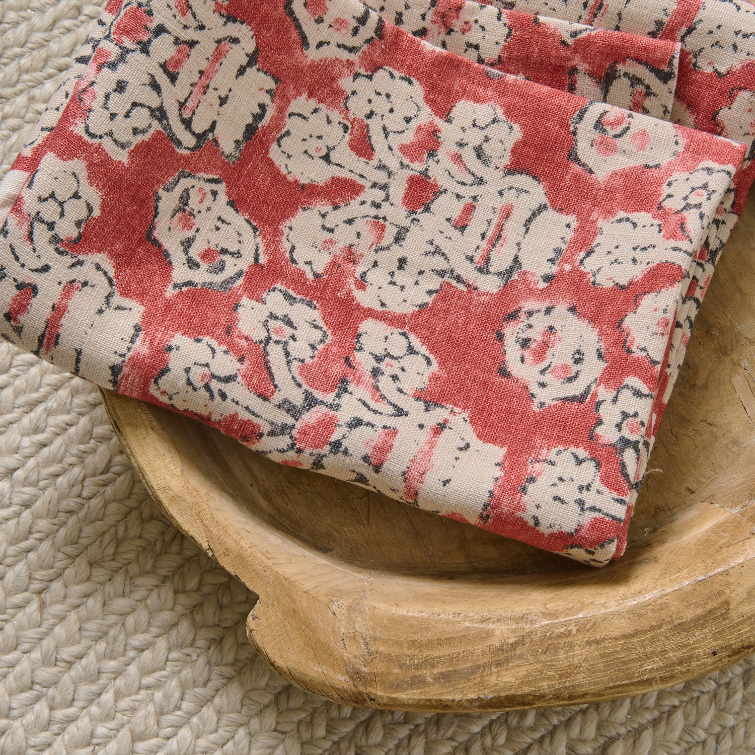A jolly printed linen fabric in red, black and cream