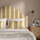 Headboard upholstered in a printed linen fabric in beige and off white, featuring a striped fern design.