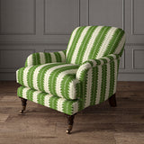Armchair upholstered in a printed linen fabric in green and off white, featuring a striped fern design.