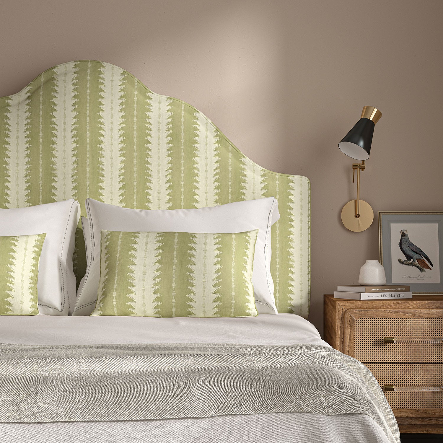 Headboard upholstered in a printed linen fabric in green and off white, featuring a striped fern design.