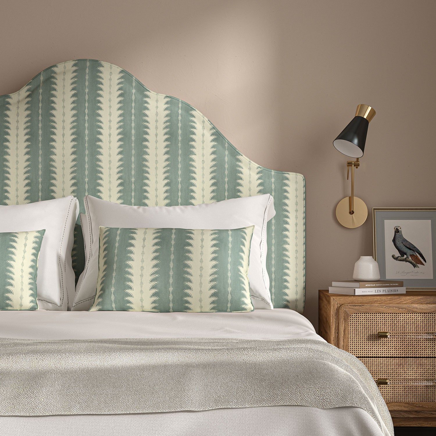 Headboard upholstered in a printed linen fabric in blue and off white, featuring a striped fern design.